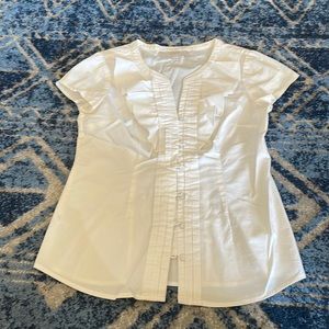 White ruffle blouse